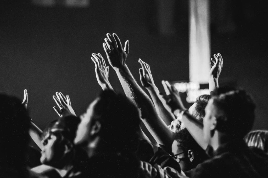grayscale-photo-of-people-raising-their-hands-1666816 Grayscale Photo of People Raising Their Hands