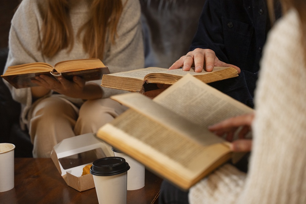 side-view-people-holding-books